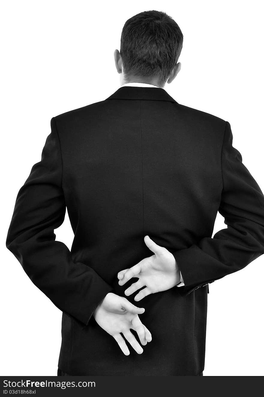 Businessman holding crossed fingers behind back isolated on white. Close-up.