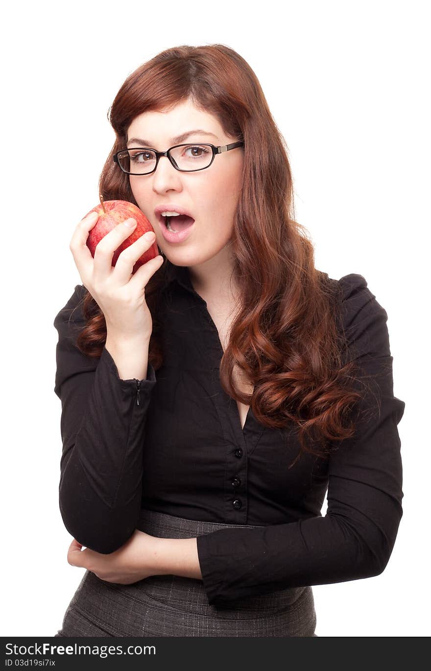 Portrait of a business woman with glasses eating an apple isolated on white