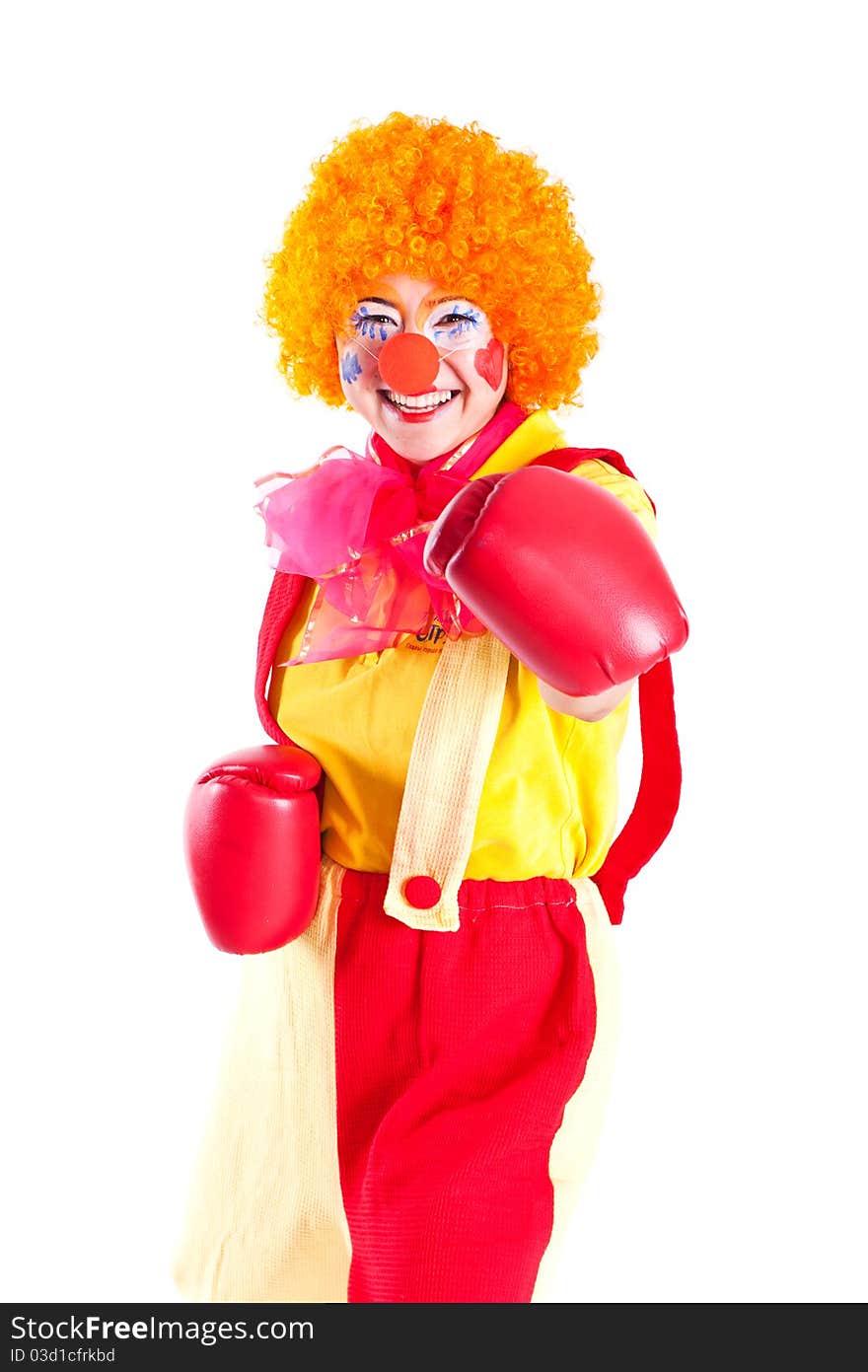 A girl dressed as a clown with red nose