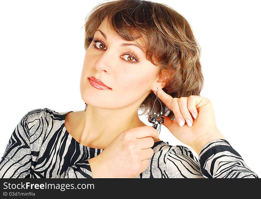 Portrait of attractive young fashion woman wearing earrings isolated on the white. Portrait of attractive young fashion woman wearing earrings isolated on the white.