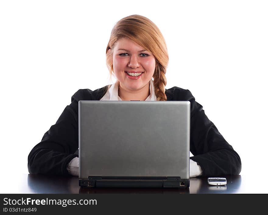 The businesswoman works at the computer at office