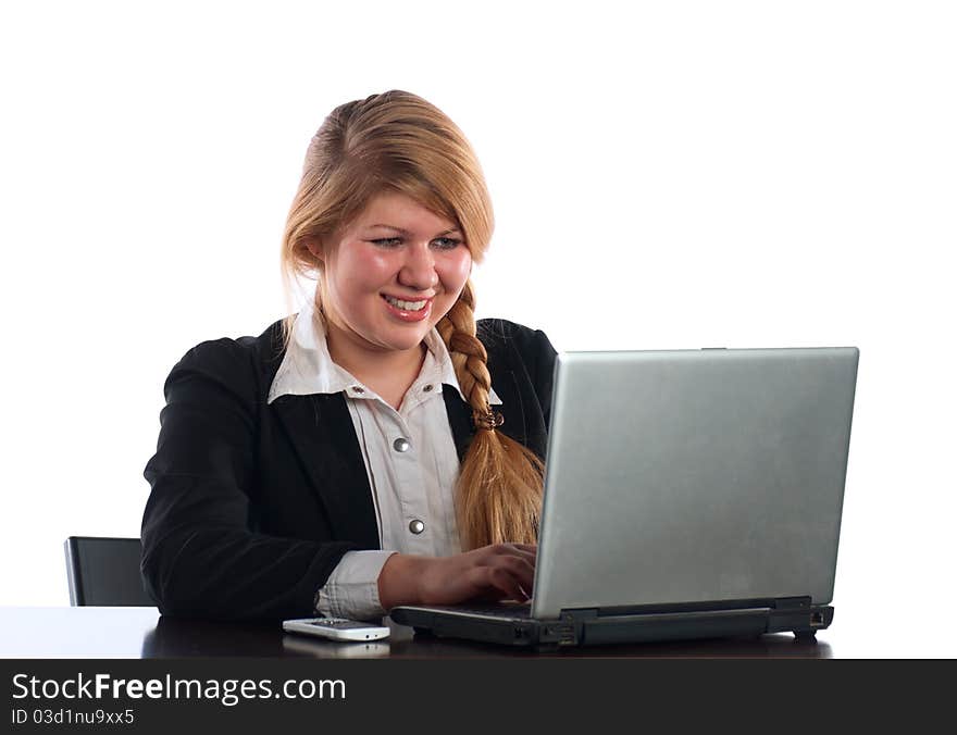 The businesswoman works at the computer at office