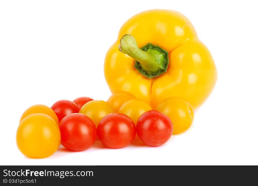 Juicy cherry tomatoes and sweet pepper isolated on the white. Juicy cherry tomatoes and sweet pepper isolated on the white.