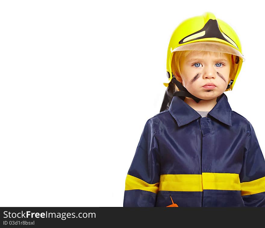 Serious little boy in fireman costume isolated on white background. Serious little boy in fireman costume isolated on white background