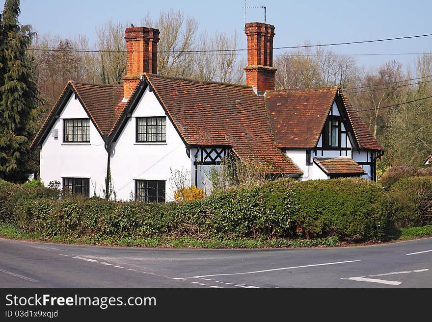 Traditional whitewashed English rural Stone Cottage and garden. Traditional whitewashed English rural Stone Cottage and garden