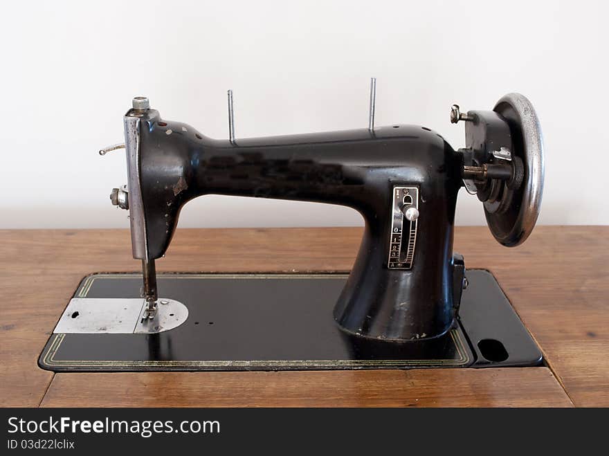 Old sewing machine in the foreground