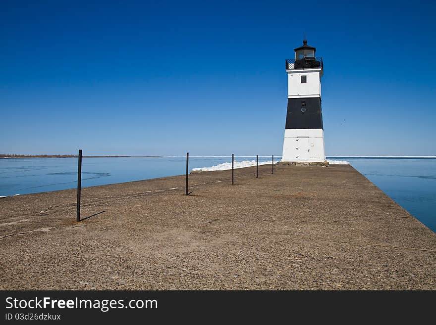 Lighthouse on Lake Erie at the end of a cement dock