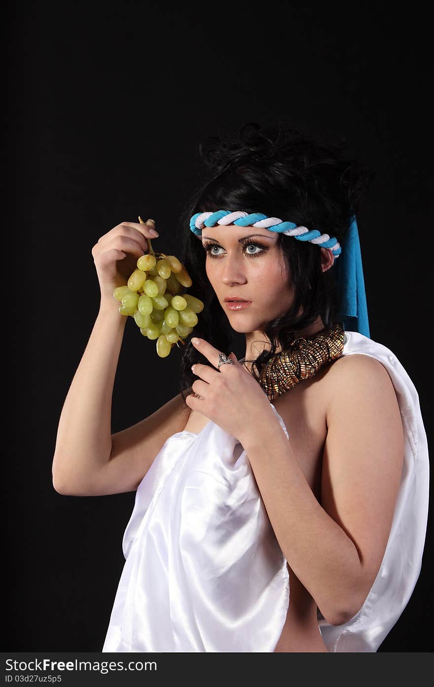 Ancient godness with a bunch of grapes. Ancient godness with a bunch of grapes