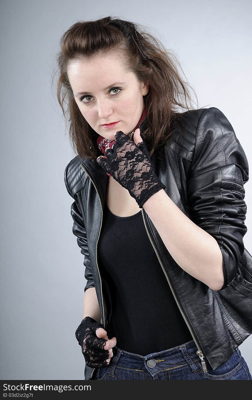 Young white girl posing with black jacket and accessories. Young white girl posing with black jacket and accessories