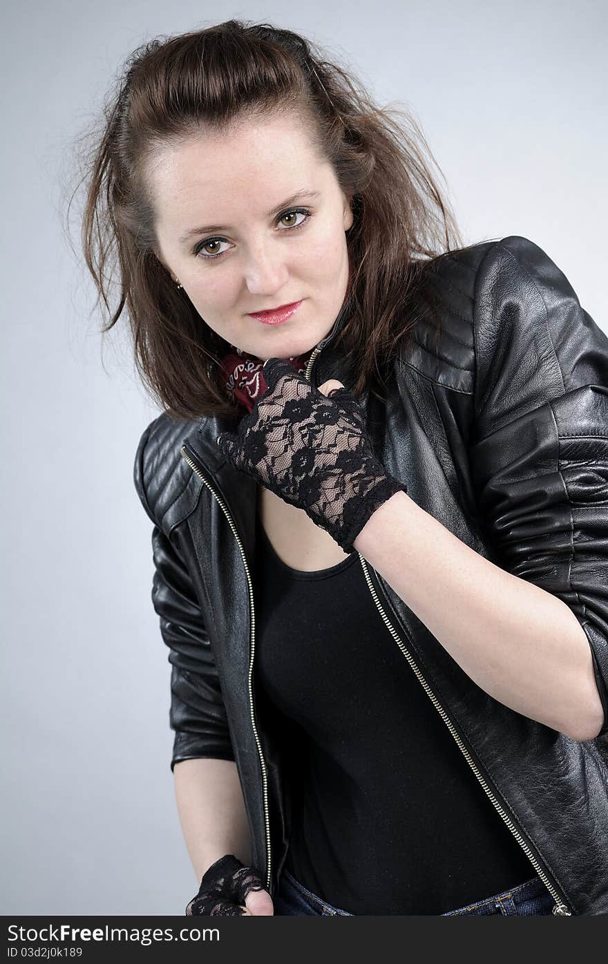 Young white girl posing with black jacket and accessories. Young white girl posing with black jacket and accessories