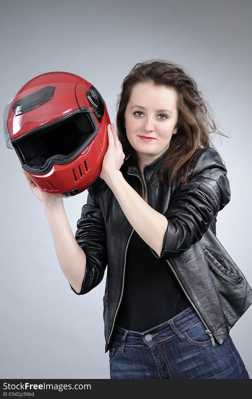 Motorcyclist arranging helmet