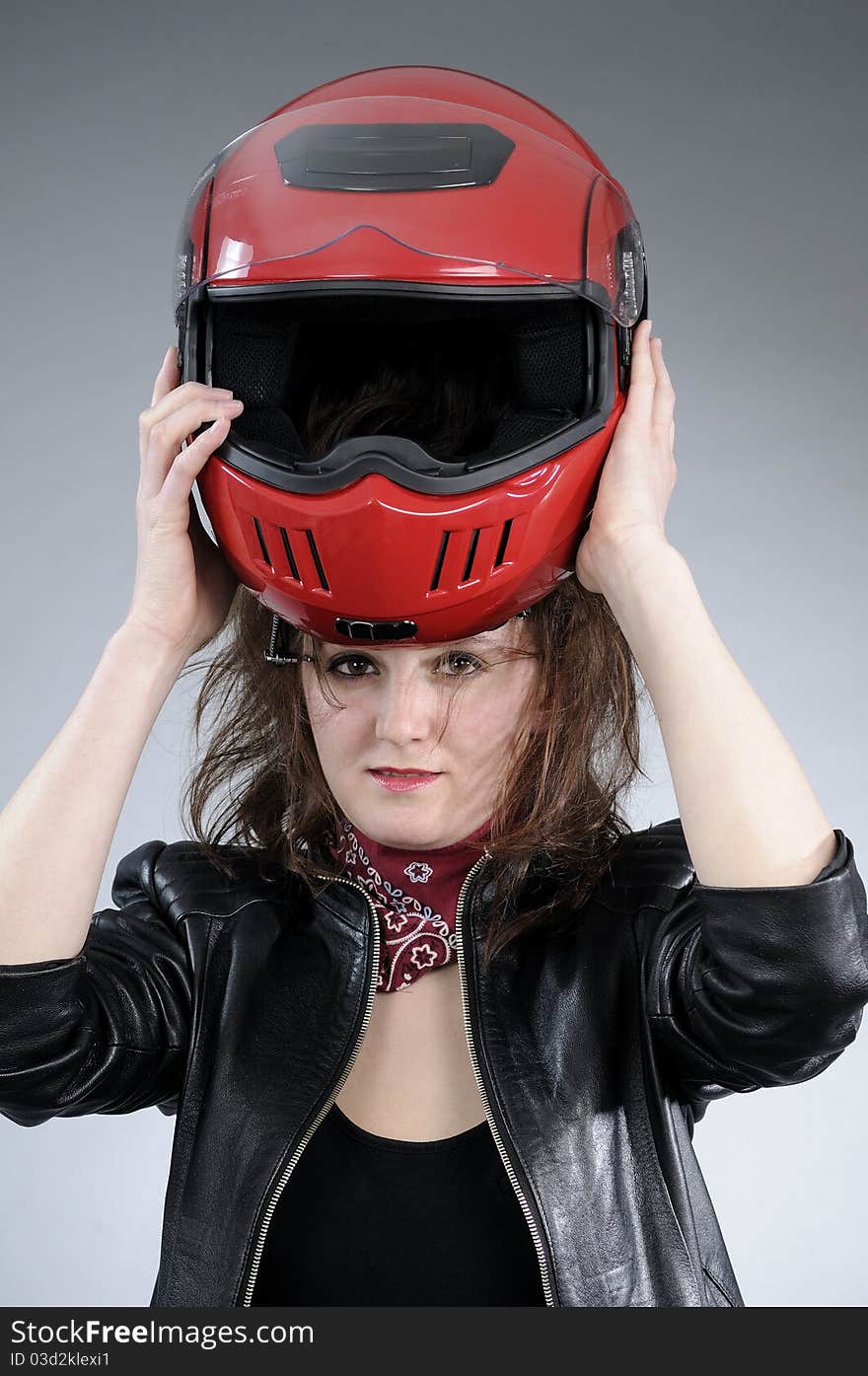 Woman arranging helmet