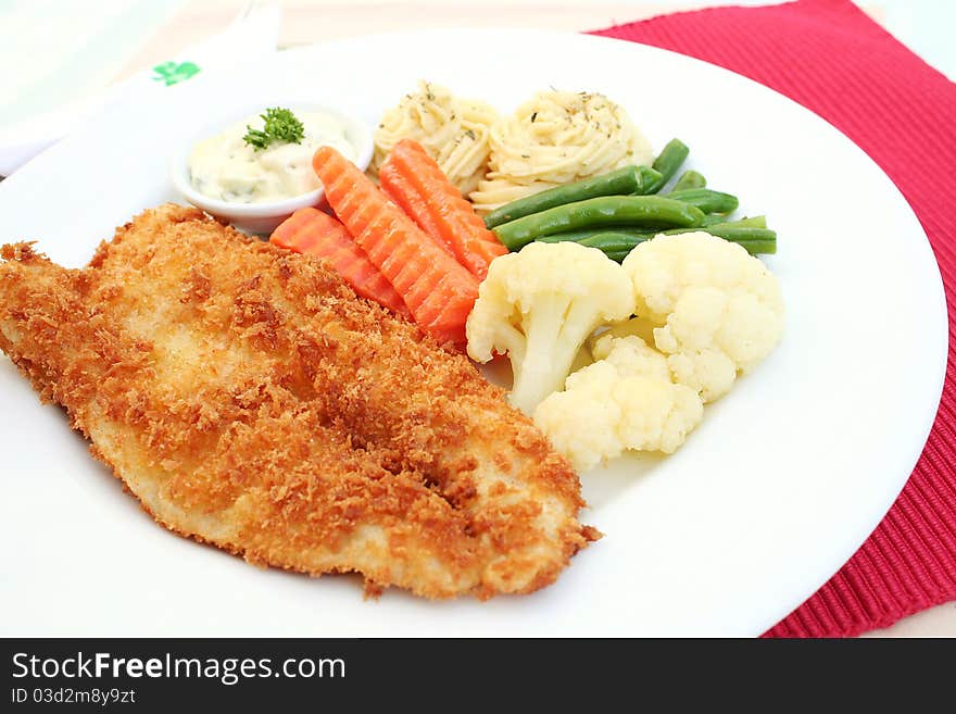 Fish steak served on a table with cream. Fish steak served on a table with cream