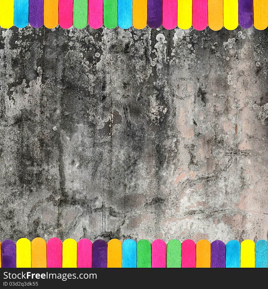 Colorful wood ice-cream stick and concrete wall