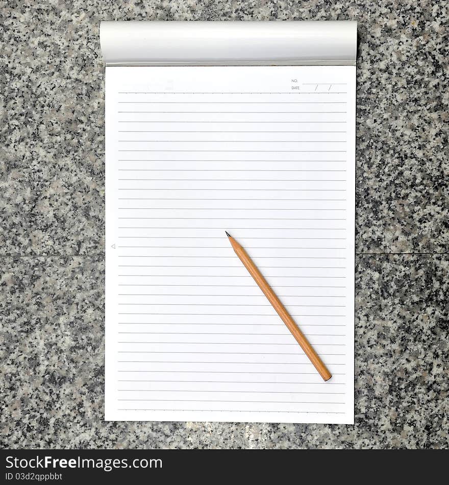 Blank open notebook and pencil