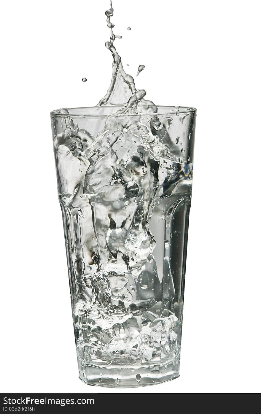 Water splashing out of a glass isolated over white background with clipping path