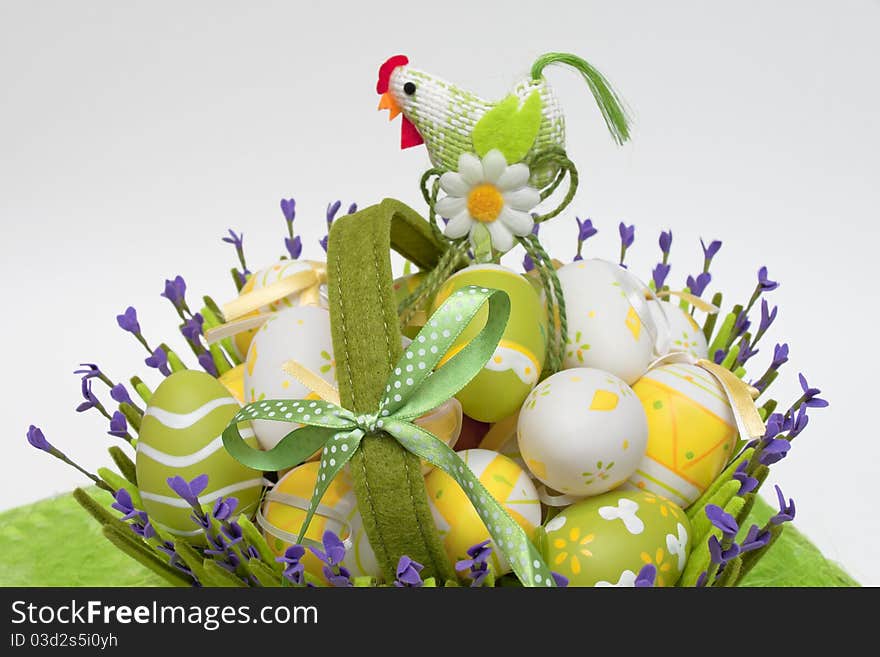 Multi-coloured eggs in a basket from a fabric from colour. Multi-coloured eggs in a basket from a fabric from colour