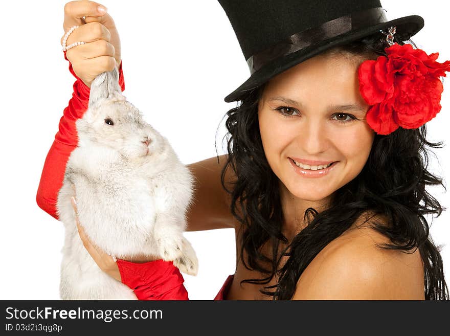 Closeup portrait of a cute magician with bunny against white background. Closeup portrait of a cute magician with bunny against white background