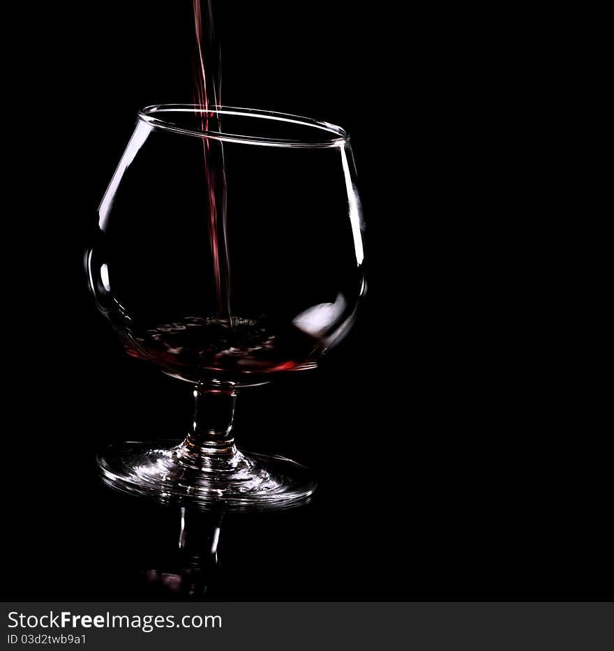 Grape juice and glass in the dark