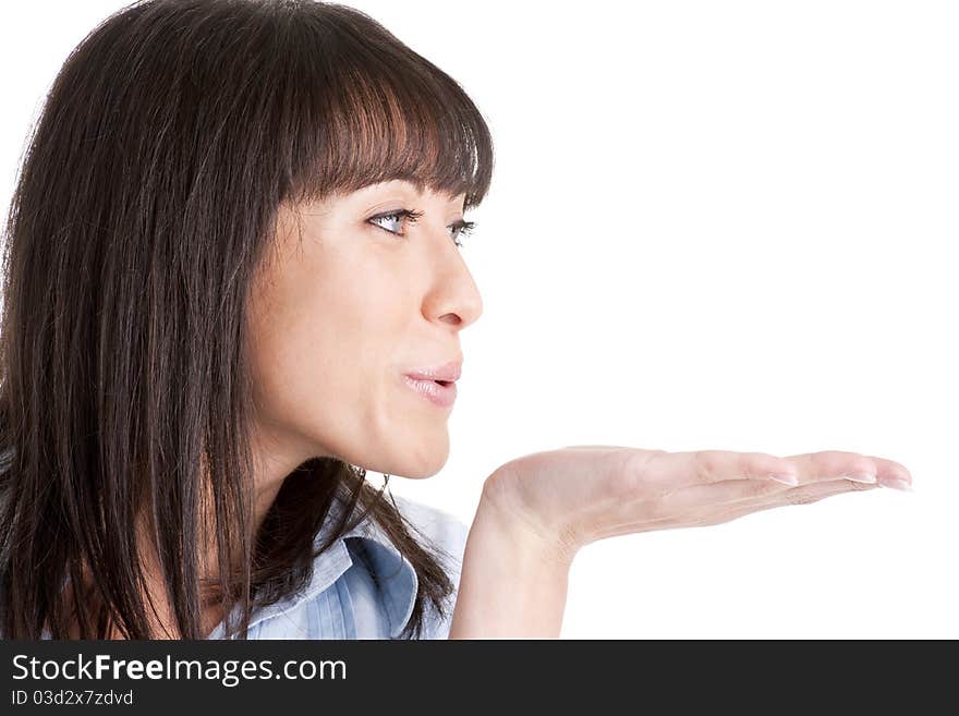 Young woman sending kiss, side view