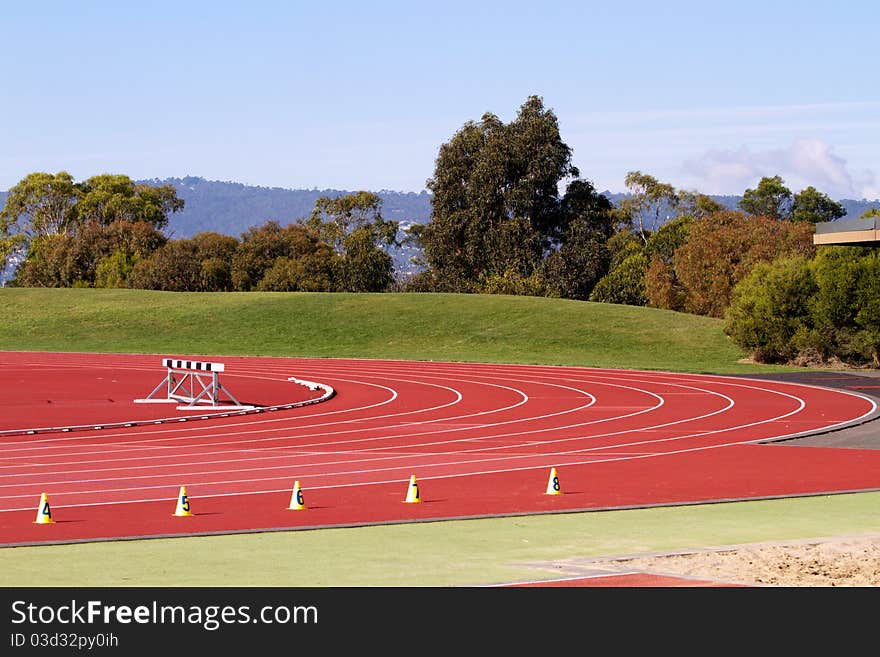 Empty sports track with witches hats. Empty sports track with witches hats.