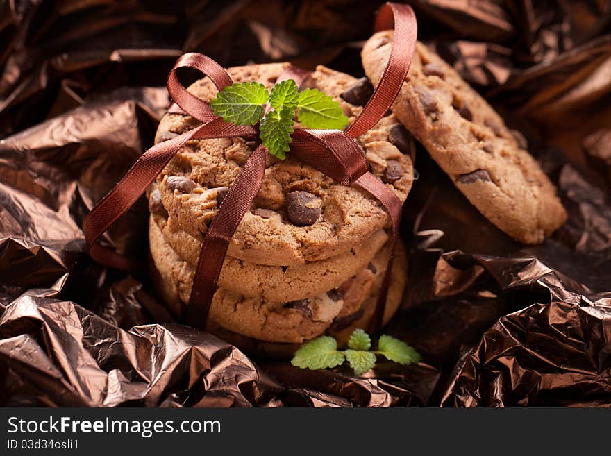 Chocolate chip cookies on brown background