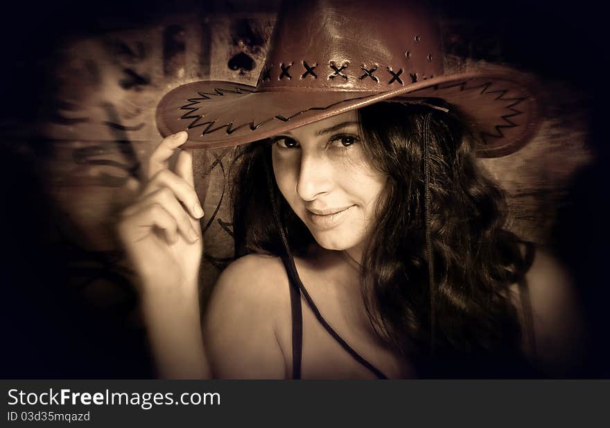 Young sexy brunet in cowboy hat closeup portrait. Young sexy brunet in cowboy hat closeup portrait