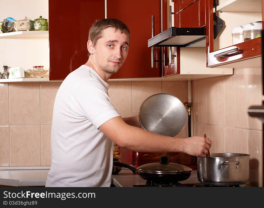 Photo of young man cooking