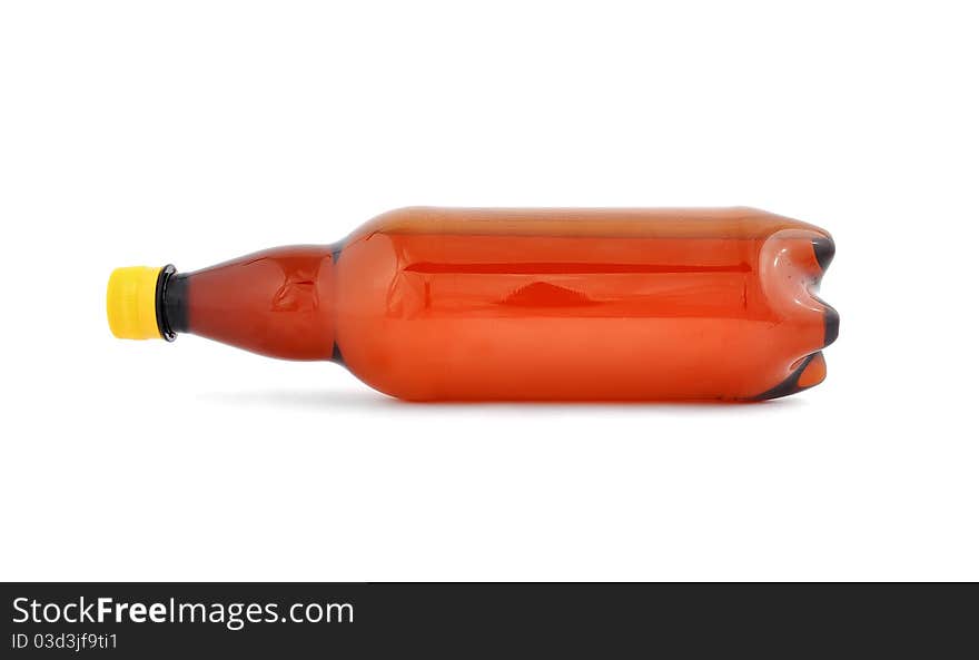 Plastic bottle of beer on white background