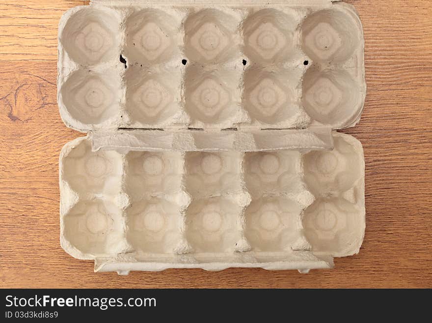 Empty eggs box on table