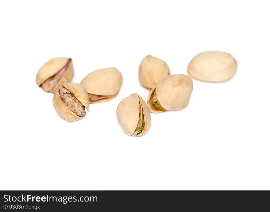 Salted pistachios on a white background