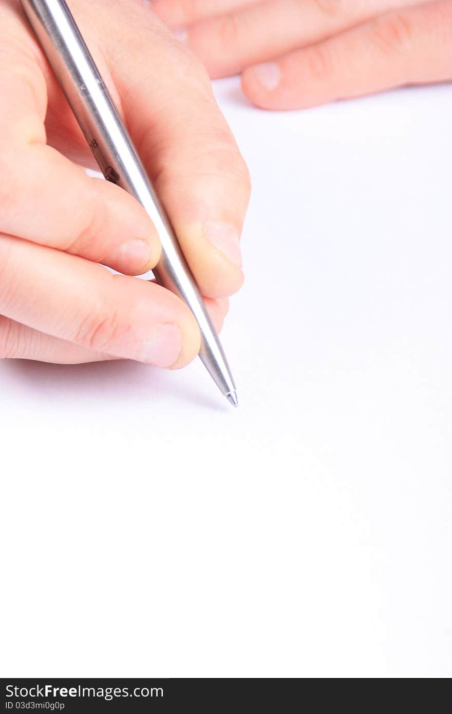 Hand with a pen writing on white paper. ideal for copy space. Hand with a pen writing on white paper. ideal for copy space