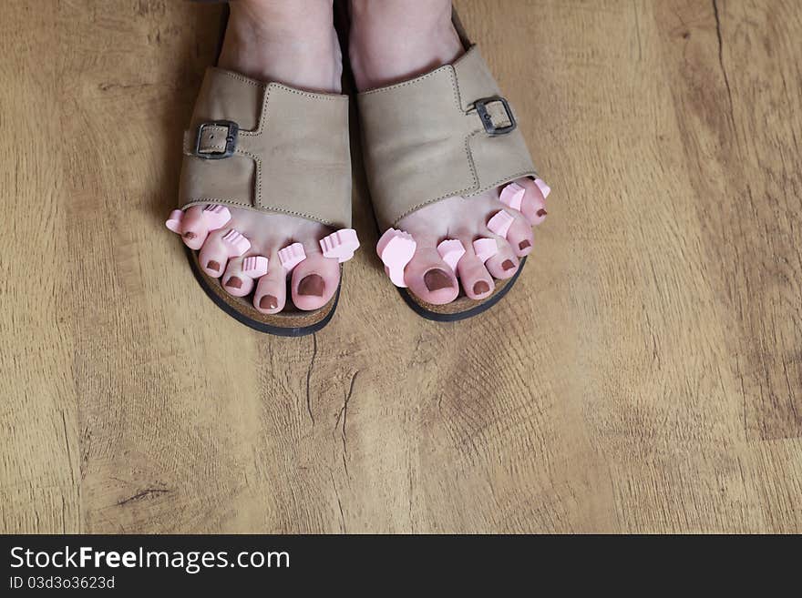 Female feet in sandal.