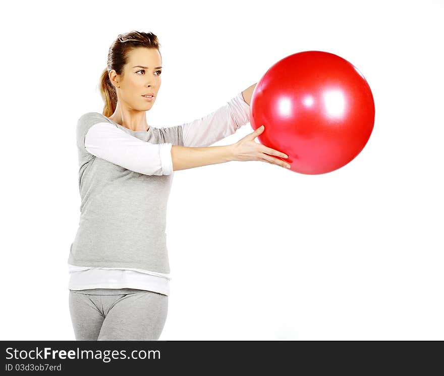 Girl exercising with a red ball 2