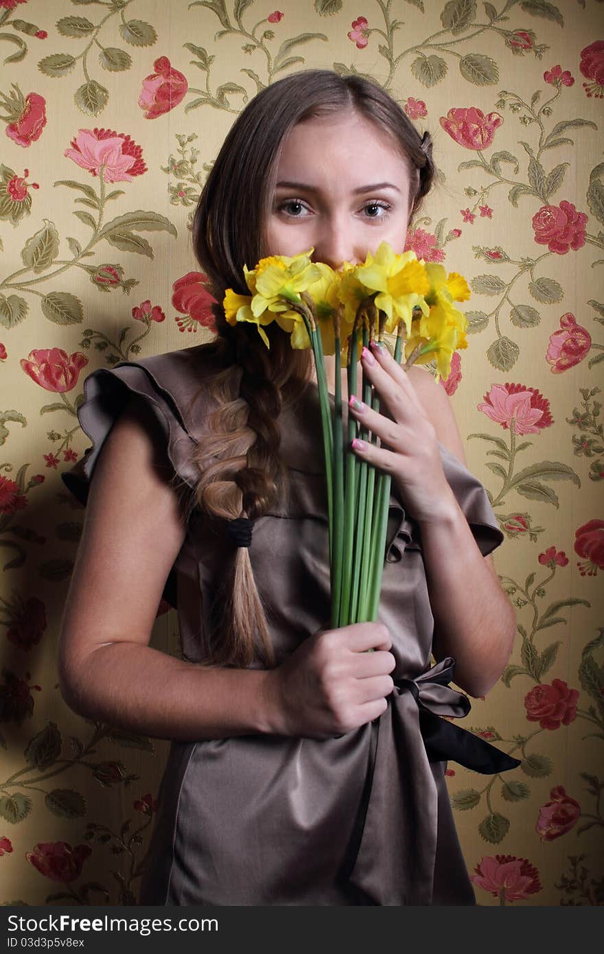 Portrait of the beautiful blond girl with narcissuses. Portrait of the beautiful blond girl with narcissuses