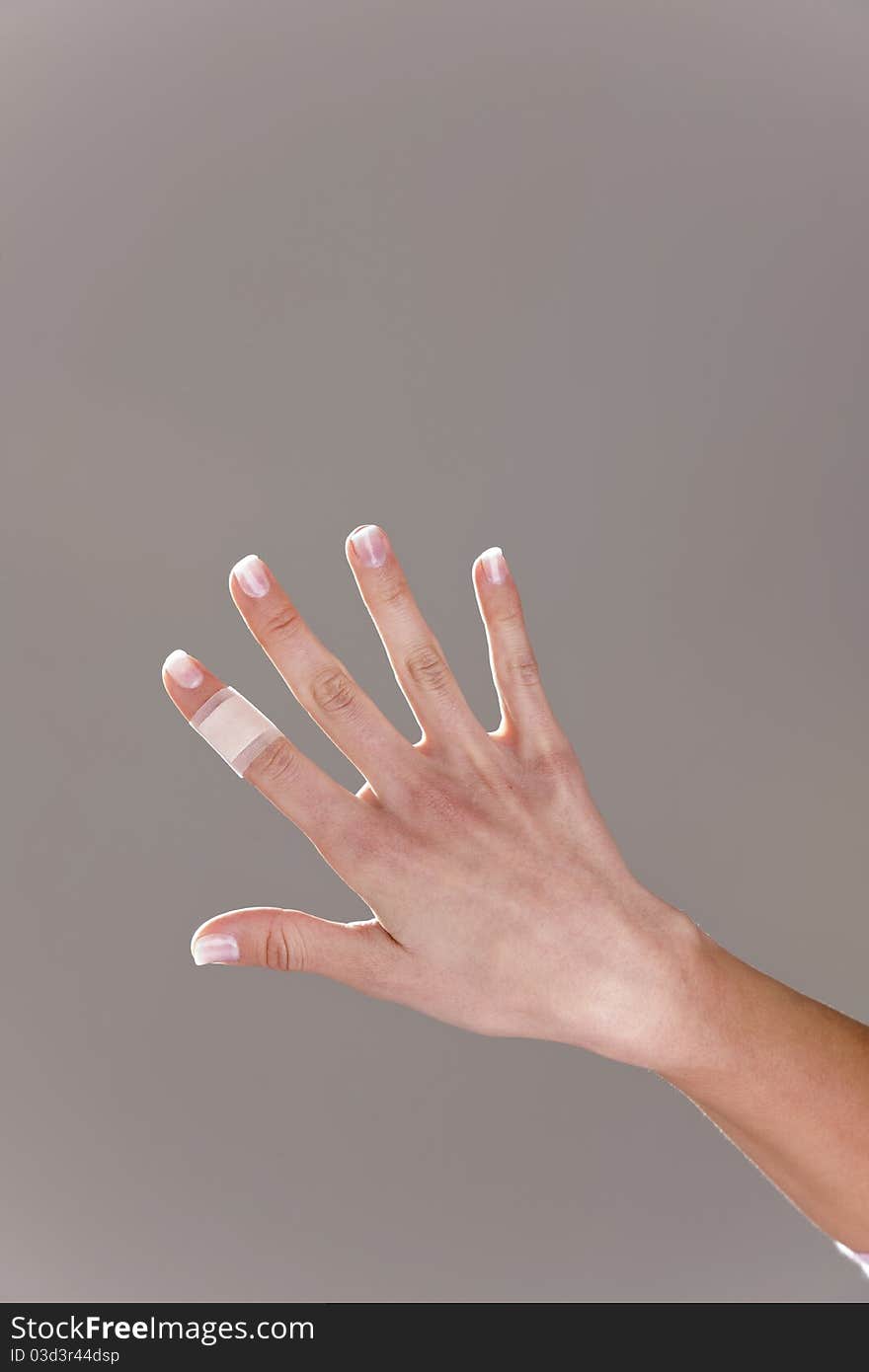 Bandage on female finger, portrait