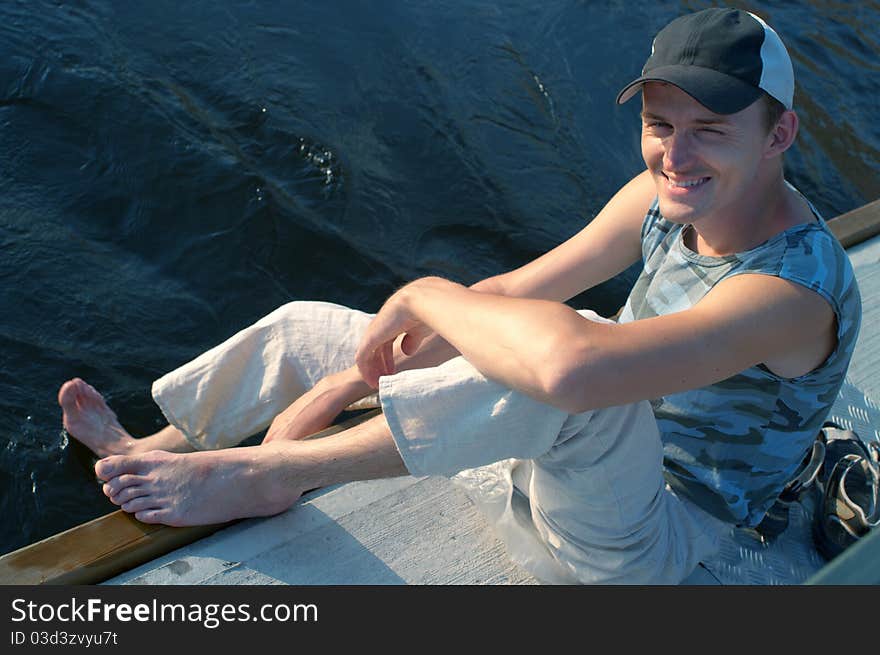 Smiling men against the river