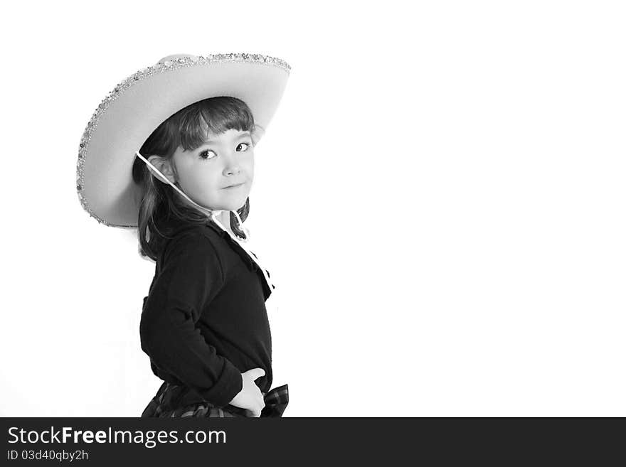 Cute little cowgirl on white