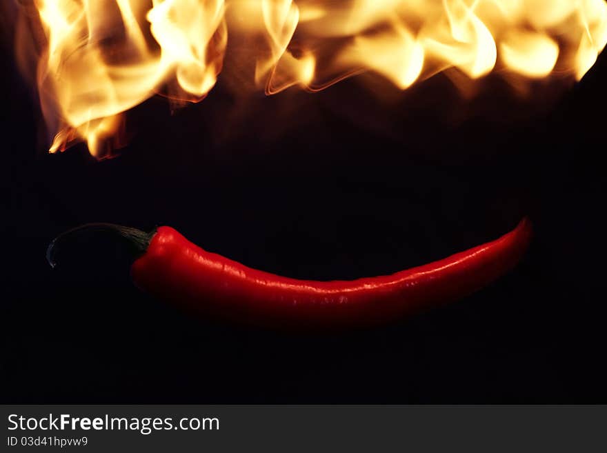 Red pepper in fire flame