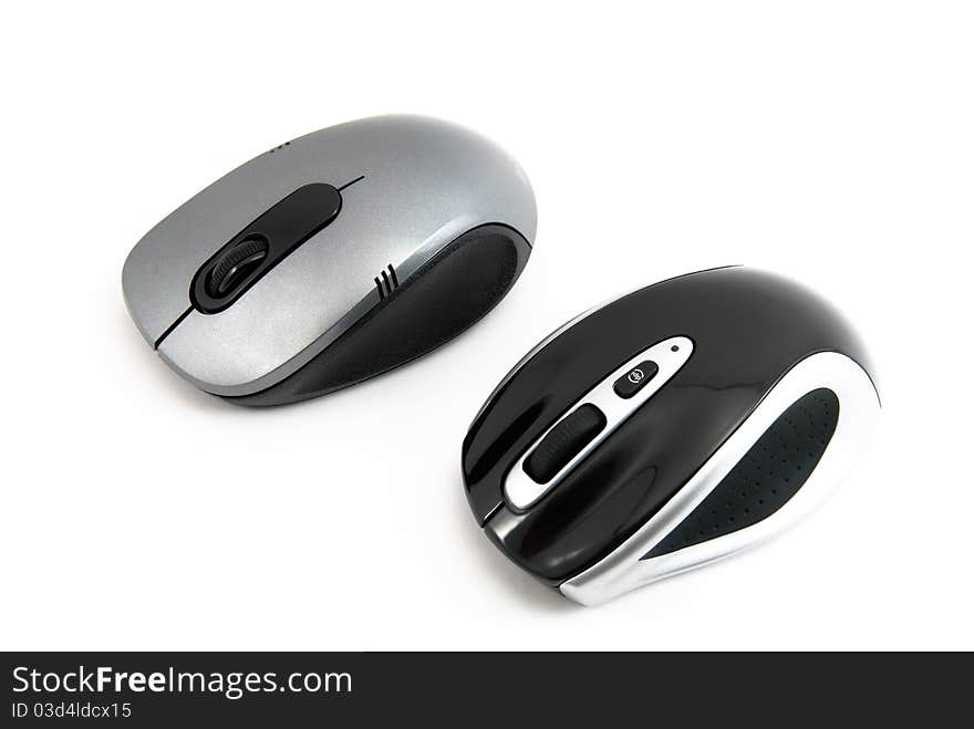 Two computer mouse of dark blue color on a white background