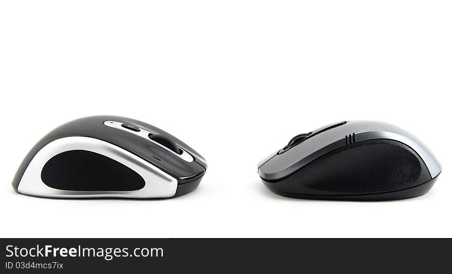 Two computer mouse of dark blue color on a white background