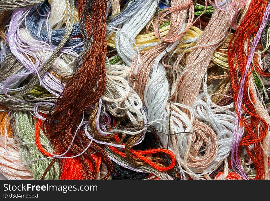Multicolored cross-stitch threads close up