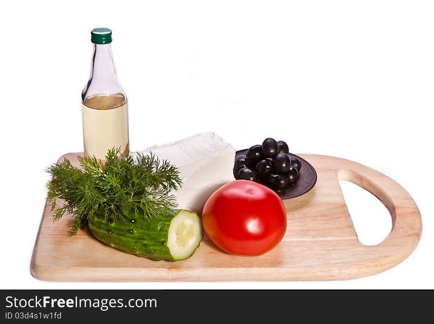 Fresh vegetables and cheese on the cutting board. Fresh vegetables and cheese on the cutting board