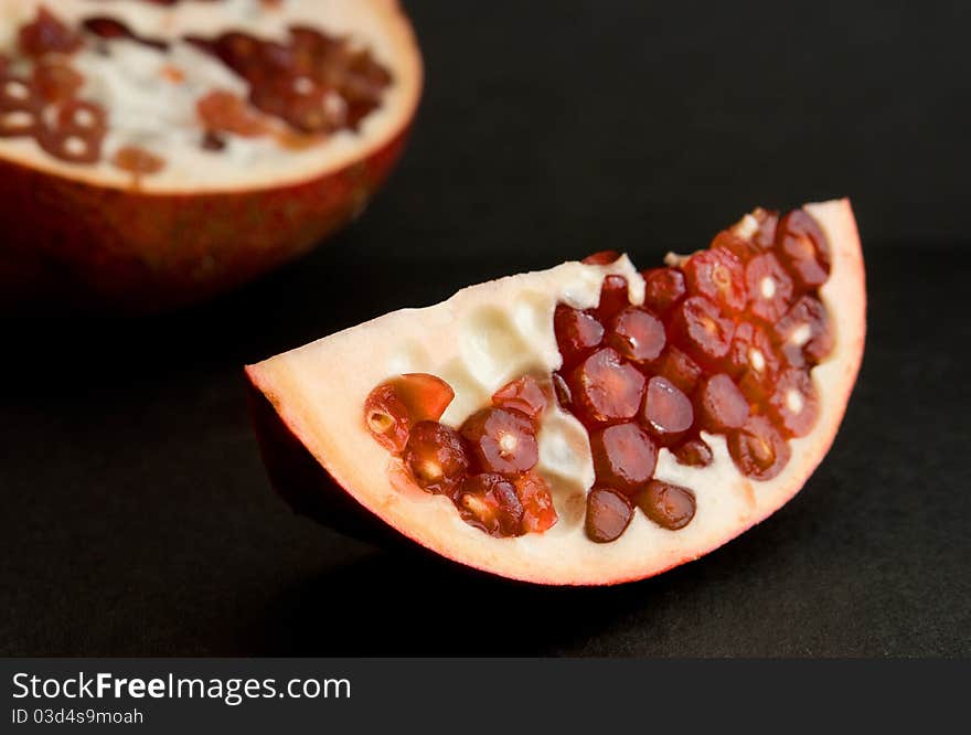 Slice of fresh juicy pomegranate