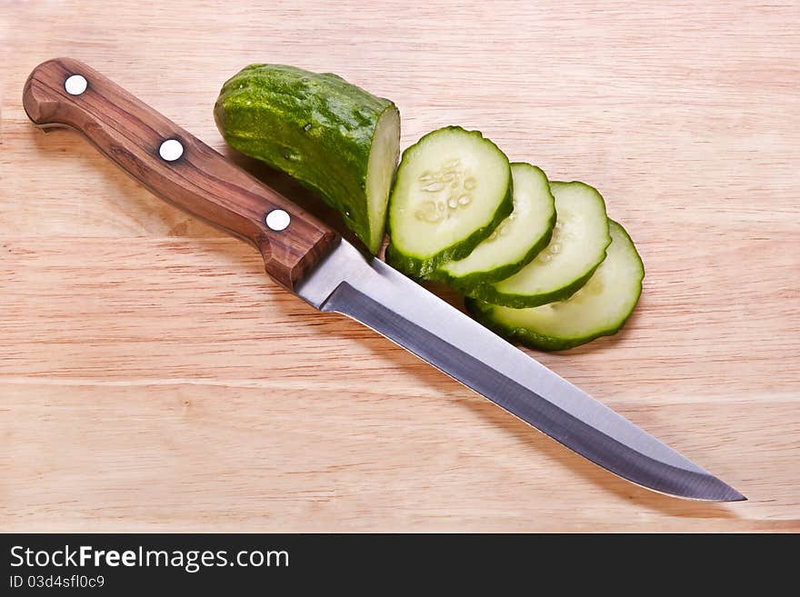 Cut cucumber with a knife