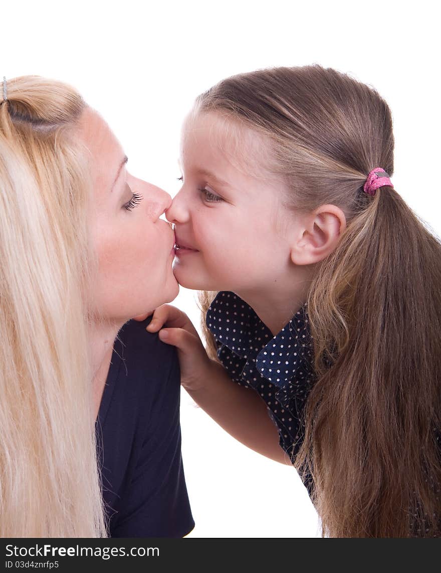 Child kissing her mother