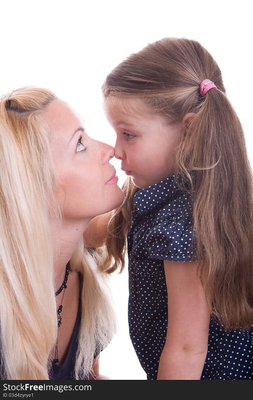 Lovely girl kissing her mother