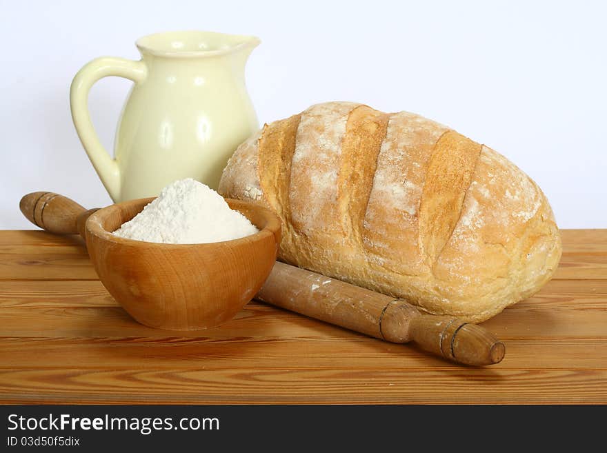 Fresh bread on the table on a white background