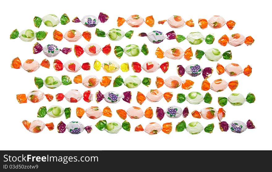 Assorted colorful candies in plastic wraps isolated in white background