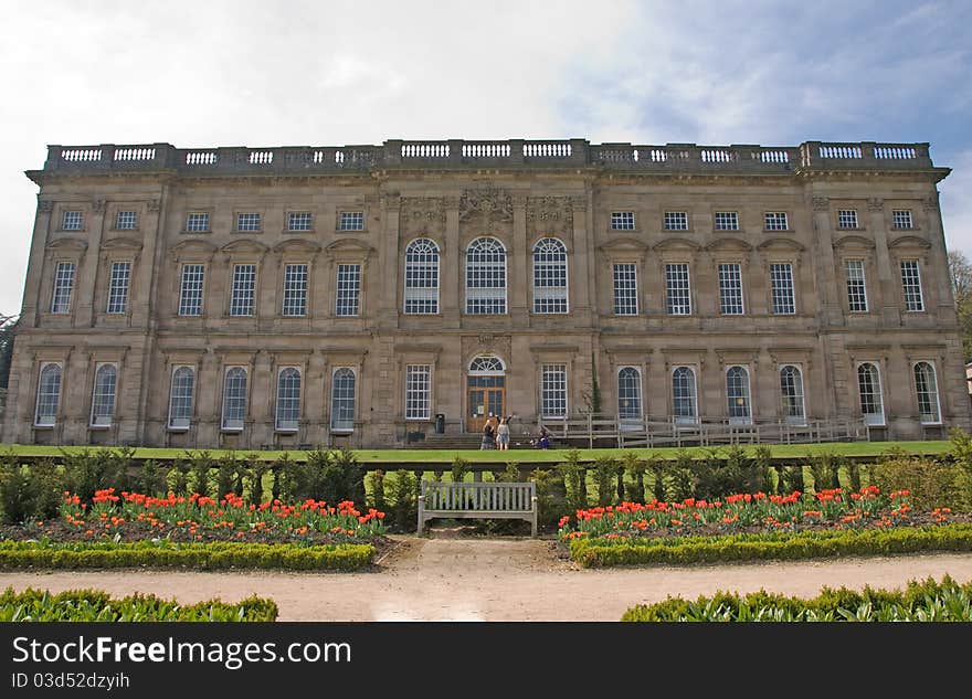 Frontage of an Eighteenth Century Stately home and lawns under a blue sky